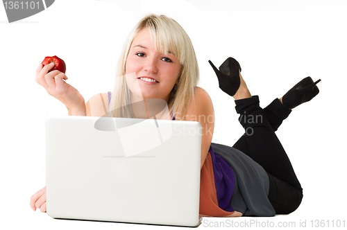 Image of Young smiling girl with laptop