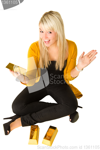 Image of Young happy girl with goldbars