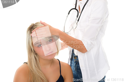 Image of Young girl examined by doctor