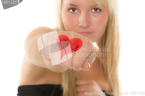 Image of Girl holding out her hand with a heart on