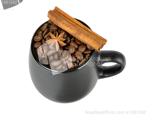Image of coffee beans and spices in a mug