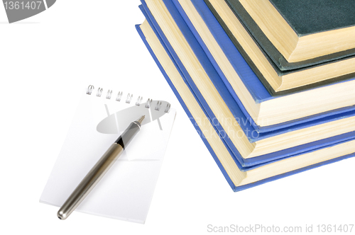 Image of old books, notebook and pen