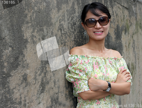 Image of Woman wearing black sunglasses