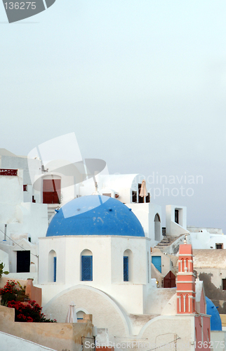 Image of houses and church on cliff