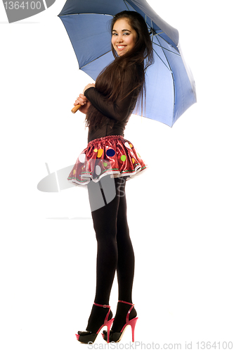 Image of Playful young woman with umbrella