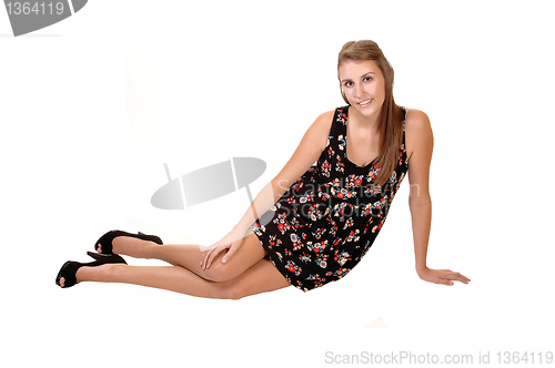 Image of Girl sitting on floor.