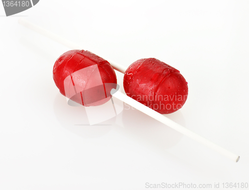Image of two red  lollipops