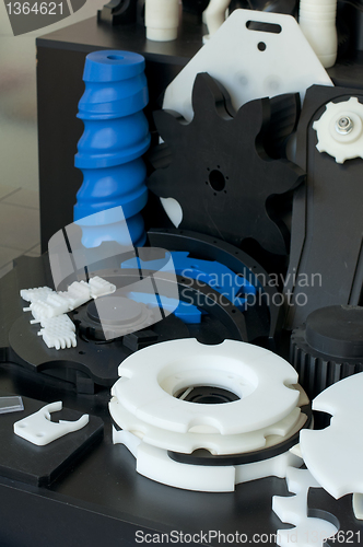 Image of Plastic machine parts. Vertical imagel