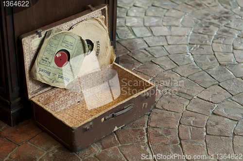 Image of Old Antique suitcase with gramophone discs