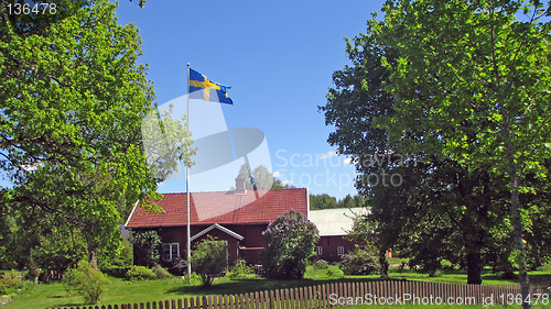 Image of Swedish house and flag