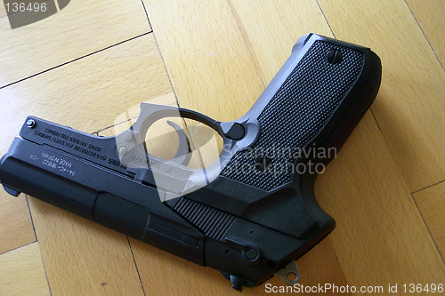 Image of a gun on the floor