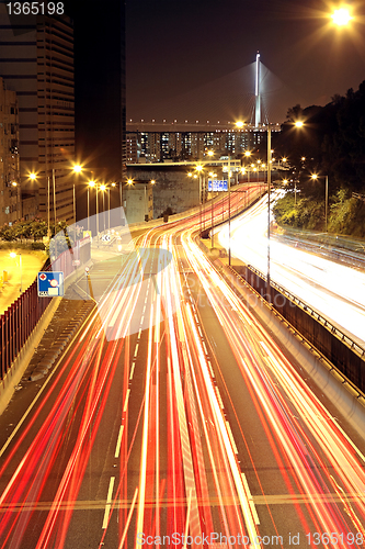 Image of traffic through downtown at night 