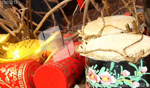 Image of Firecrackers and a Chinese Traditional Wooden Drum 