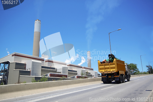 Image of coal fired power station and car moving