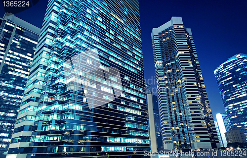 Image of Tall office buildings by night 