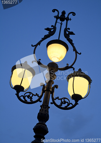 Image of Old lamp at dusk