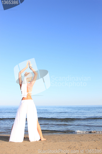 Image of  woman relaxing on the beach