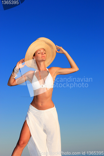 Image of  woman relaxing on the beach