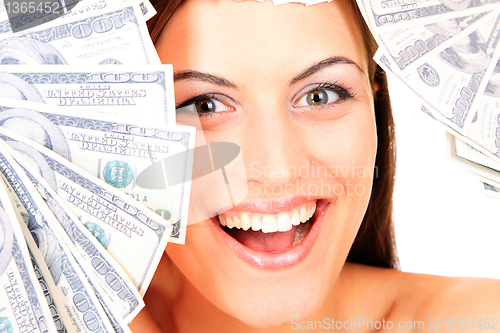 Image of Young happy woman with dollar