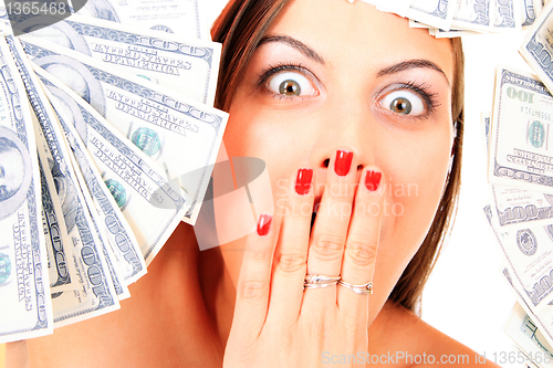 Image of Young happy woman with dollar