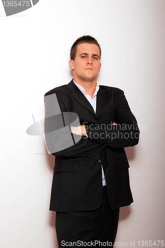 Image of Cool businessman standing 