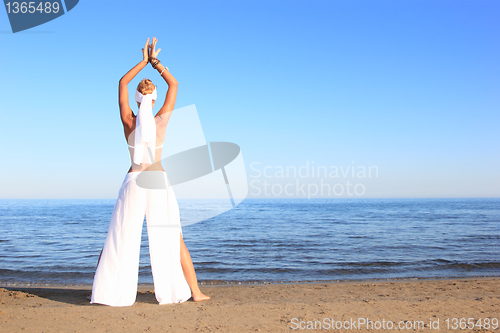 Image of  woman relaxing on the beach