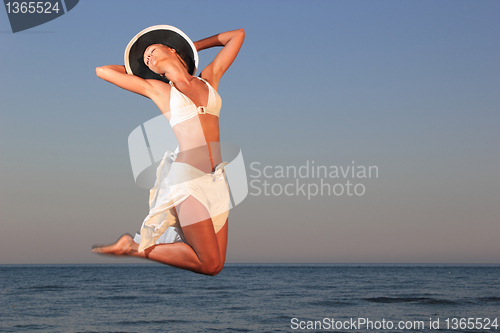 Image of  woman relaxing on the beach