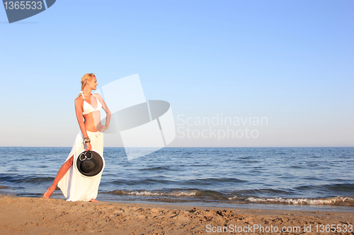 Image of  woman relaxing on the beach