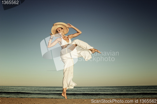 Image of  woman relaxing on the beach