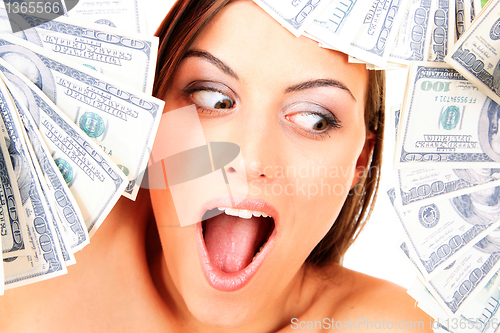 Image of Young happy woman with dollar