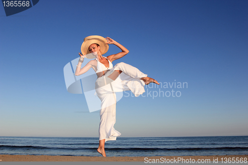 Image of  woman relaxing on the beach