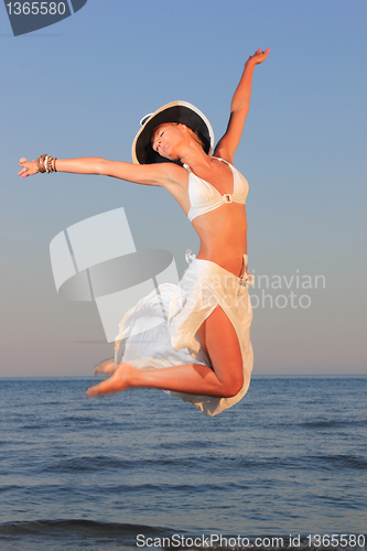 Image of  woman relaxing on the beach