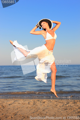 Image of  woman relaxing on the beach