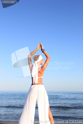 Image of  woman relaxing on the beach