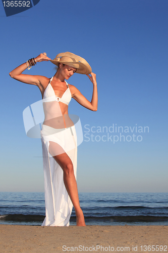 Image of  woman relaxing on the beach