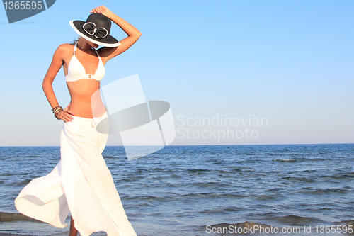 Image of  woman relaxing on the beach