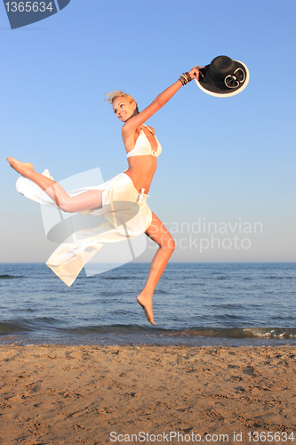 Image of  woman relaxing on the beach