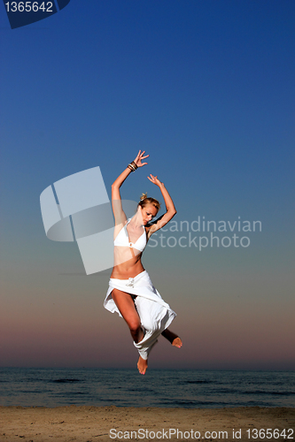 Image of  woman relaxing on the beach