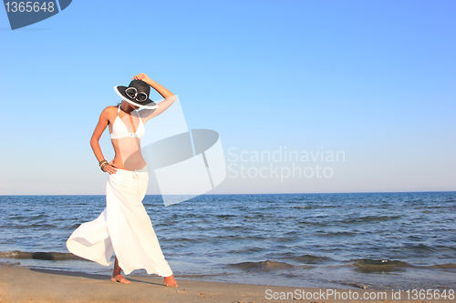 Image of  woman relaxing on the beach