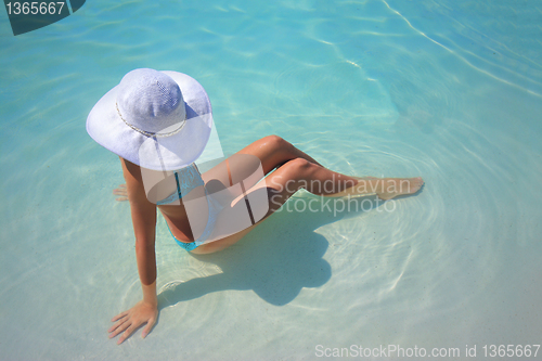 Image of Young woman in a swimming pool