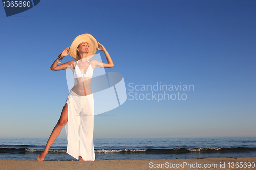 Image of  woman relaxing on the beach