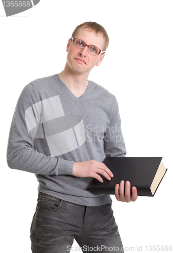Image of Student athletic read a thick book.