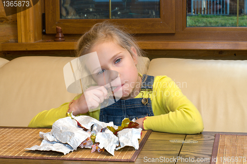 Image of Girl with chocolates.