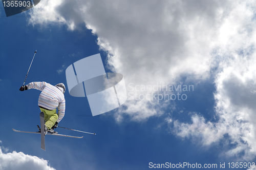 Image of Freestyle ski jumper with crossed skis