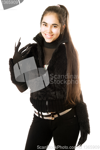 Image of Portrait of smiling young brunette in gloves