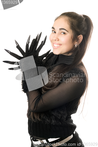 Image of Portrait of cheerful young woman in gloves