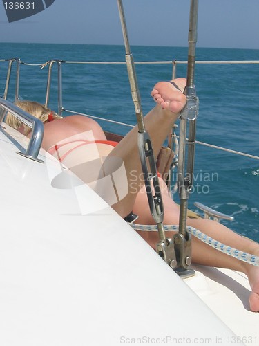 Image of tanning on a sailboat