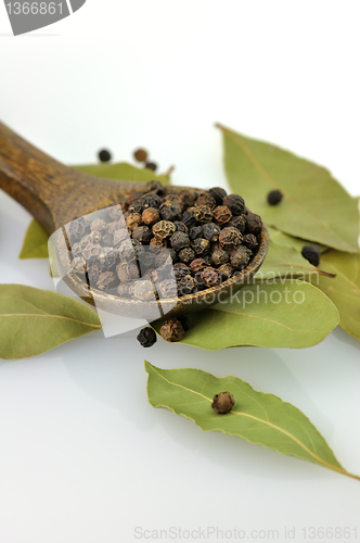 Image of black pepper and bay leaves