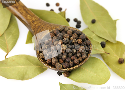 Image of black pepper and bay leaves