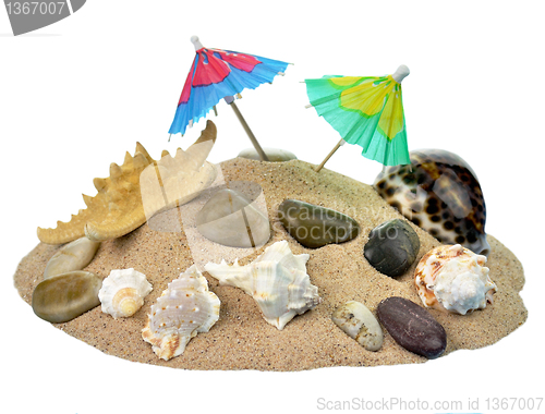 Image of Sand with an umbrella and seashells 